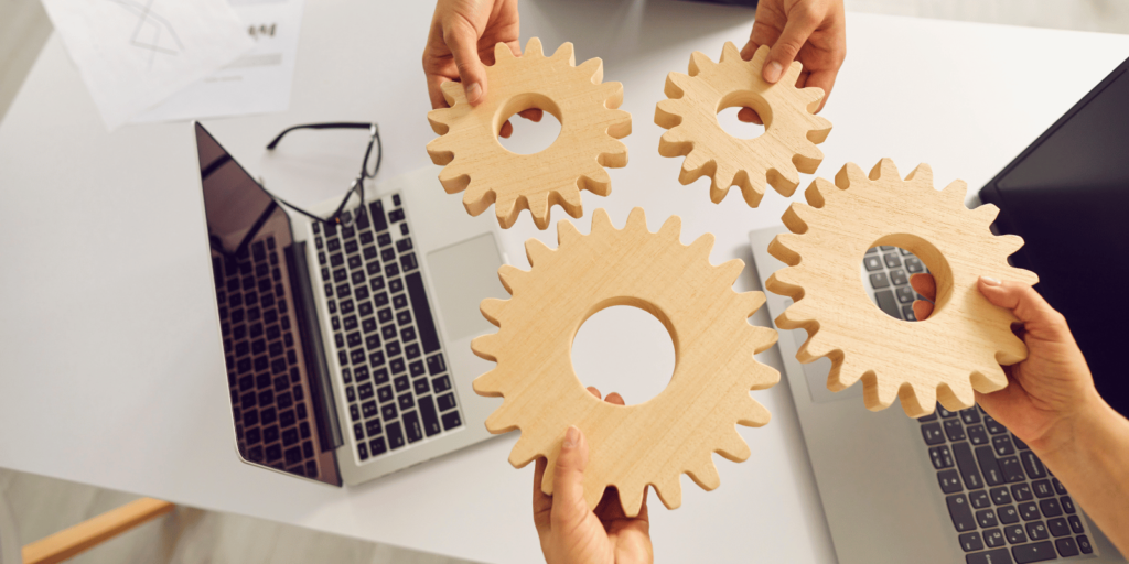 Zusammenarbeit mit Autohändlern – Symbolische Zahnräder stehen für erfolgreiche Kooperationen im Autoankauf.
